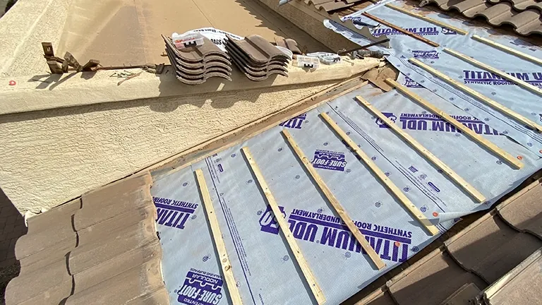 White Leaf crew removing old roof tiles on a Gilbert home